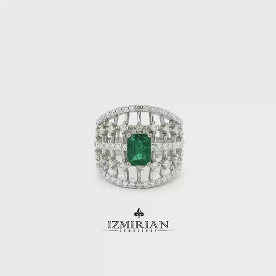 Emerald cage statement ring in white gold shown in motion