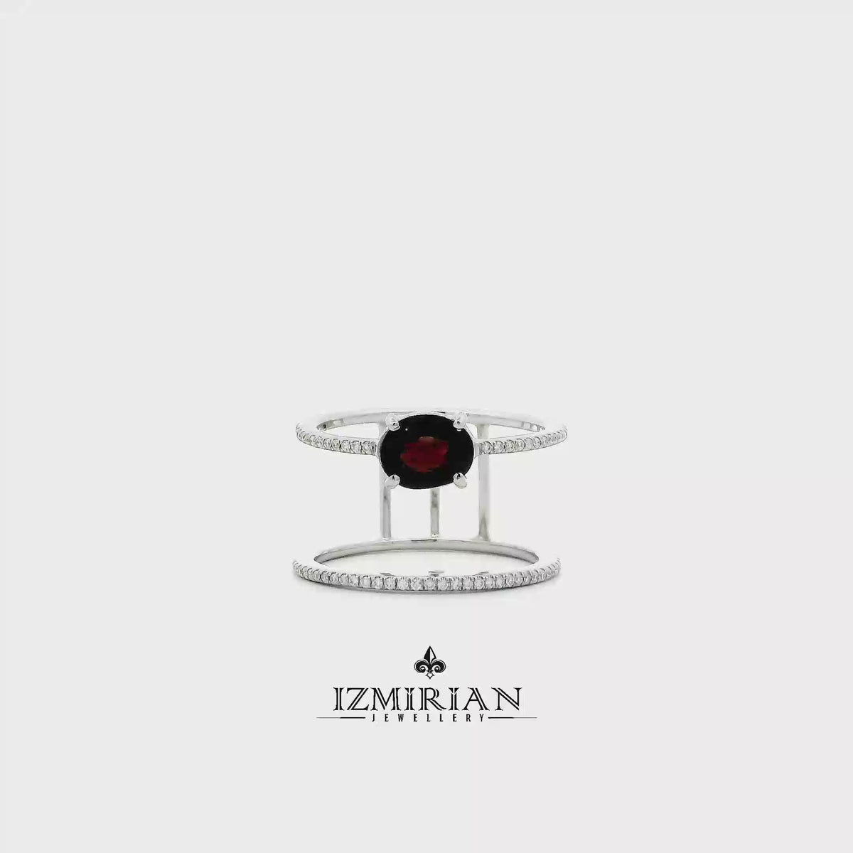 Black garnet floating cuff ring in white gold shown in motion