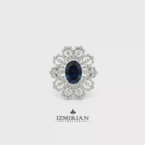 Ornate white gold sapphire and diamond halo ring shown in motion