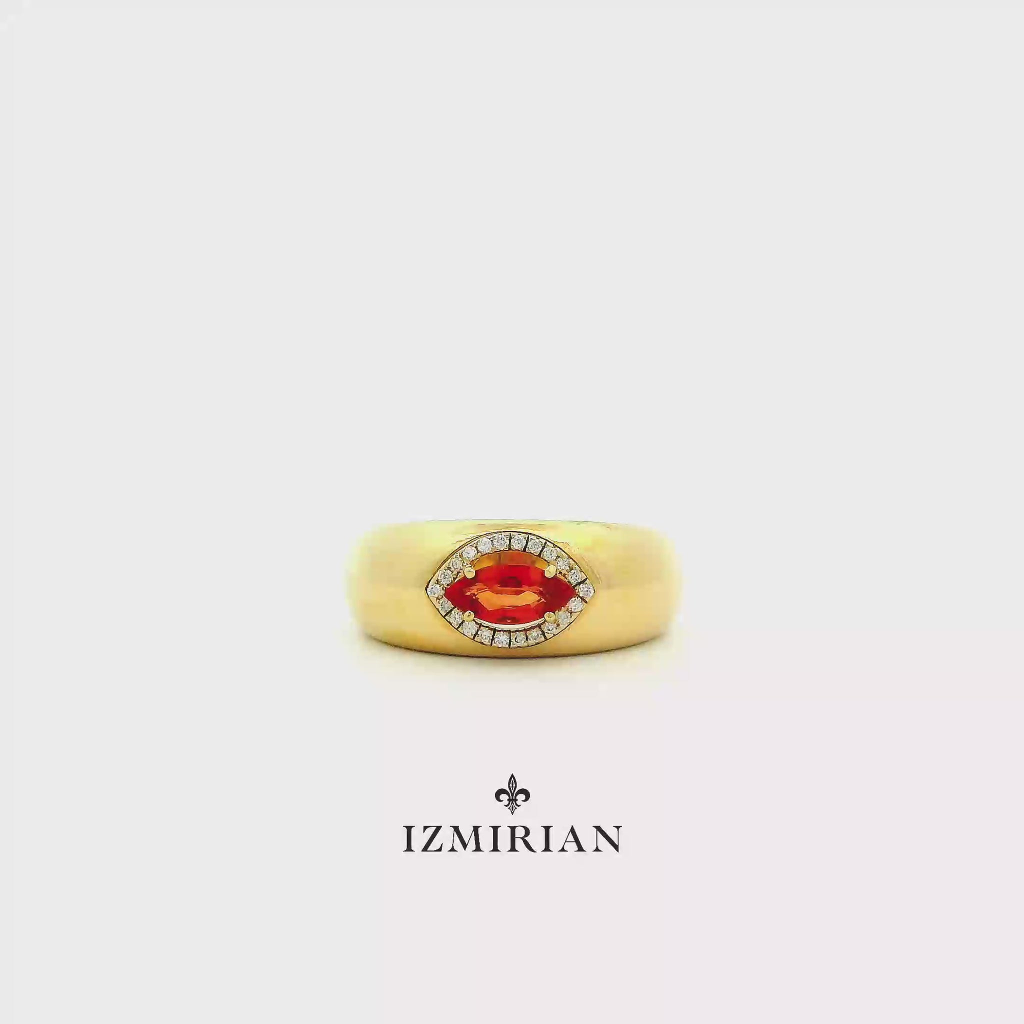 Marquise ruby diamond signet ring in yellow gold shown in motion
