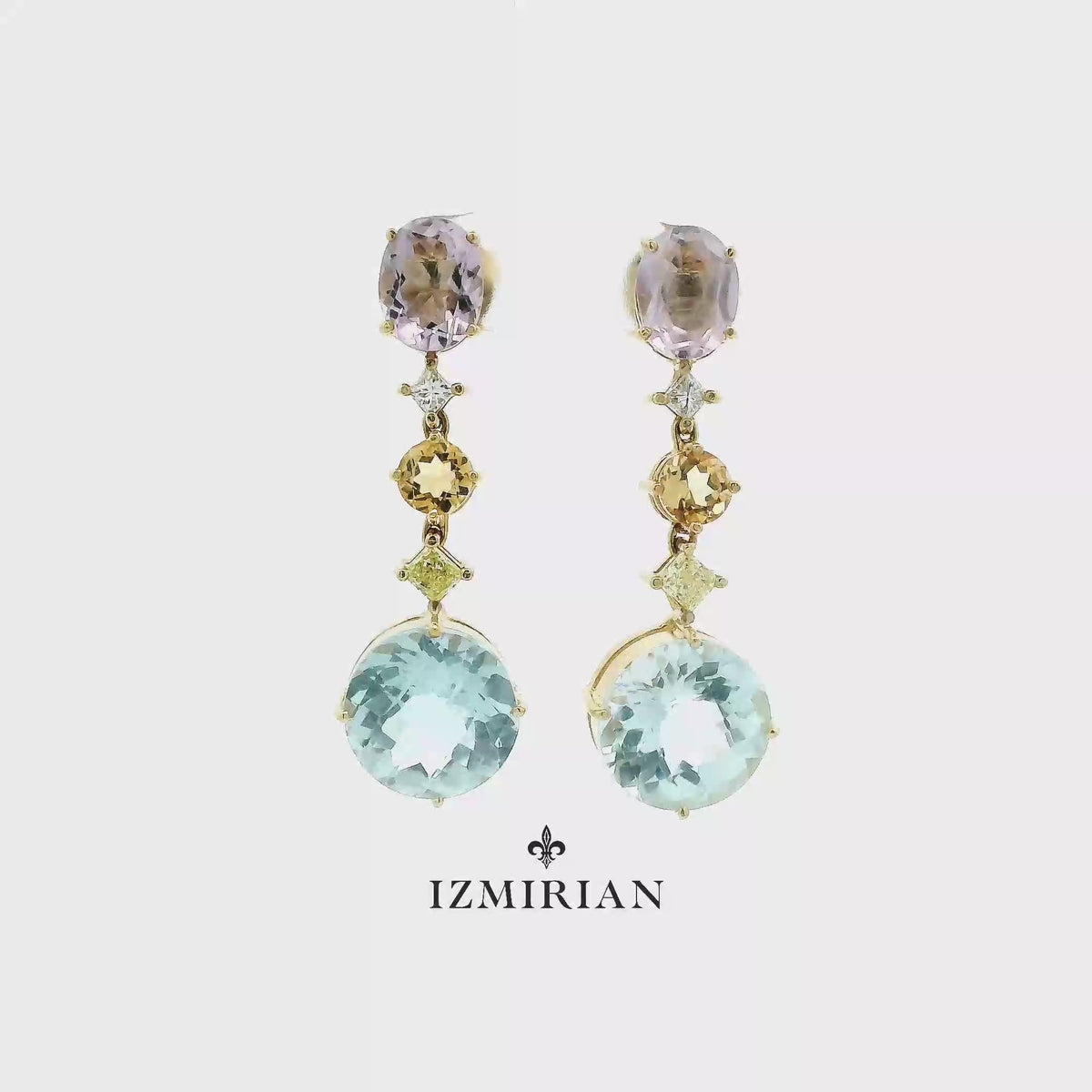 Multicolor gemstone drop earrings in yellow gold shown in motion