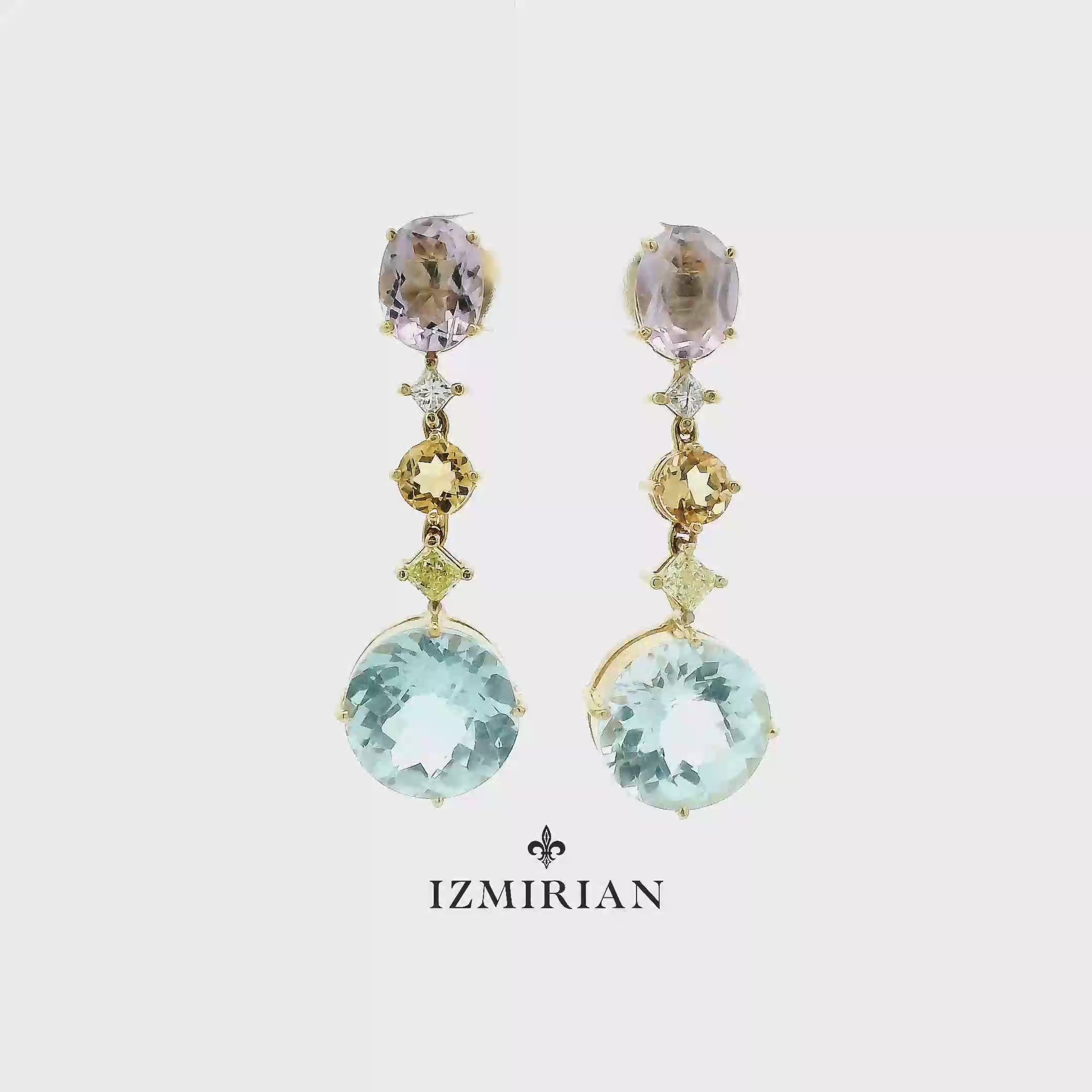 Multicolor gemstone drop earrings in yellow gold shown in motion