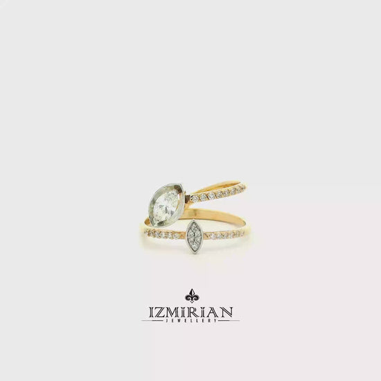 Pear diamond open ring in yellow and white gold shown in motion