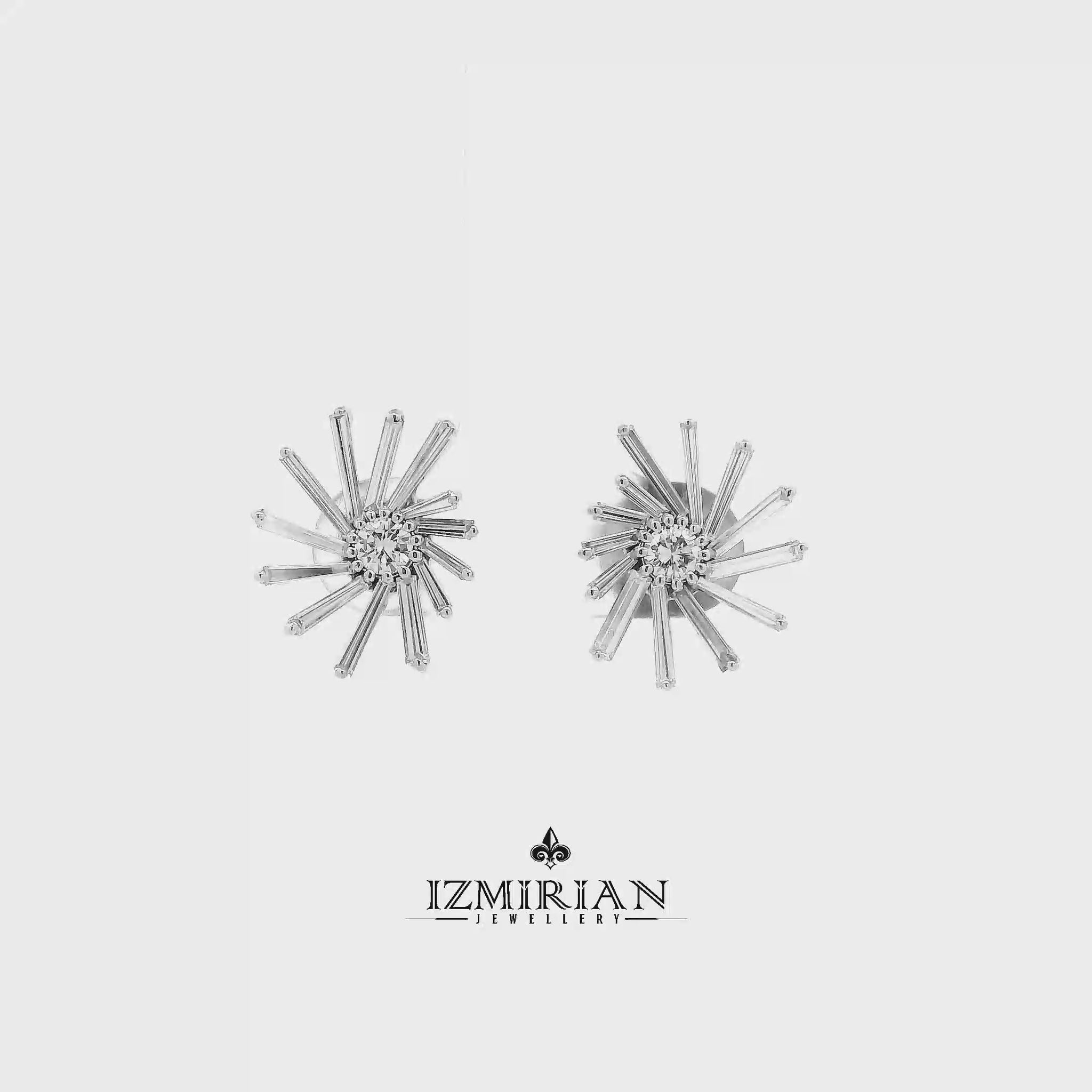 Baguette diamond sunburst stud earrings in white gold shown in motion