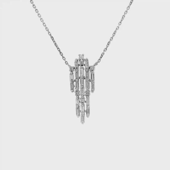 Baguette diamond cascade pendant in white gold shown in motion