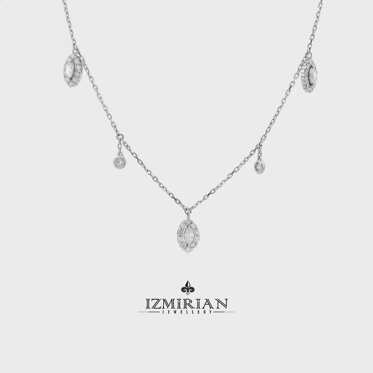 Marquise diamond drop necklace in white gold shown in motion