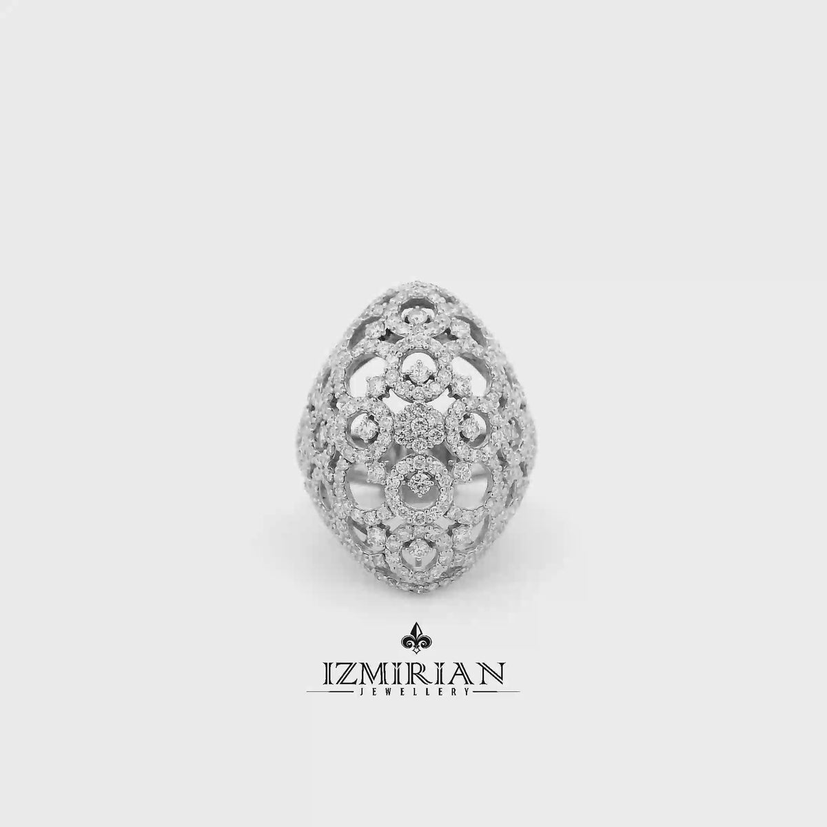 Diamond filigree dome ring in white gold shown in motion