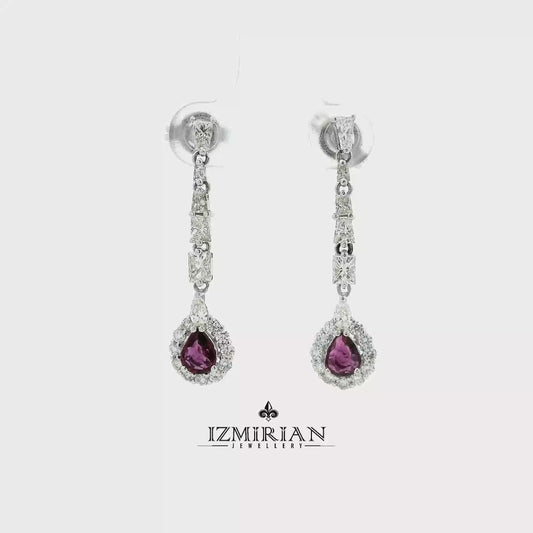 Pink sapphire and diamond drop earrings in white gold shown in motion