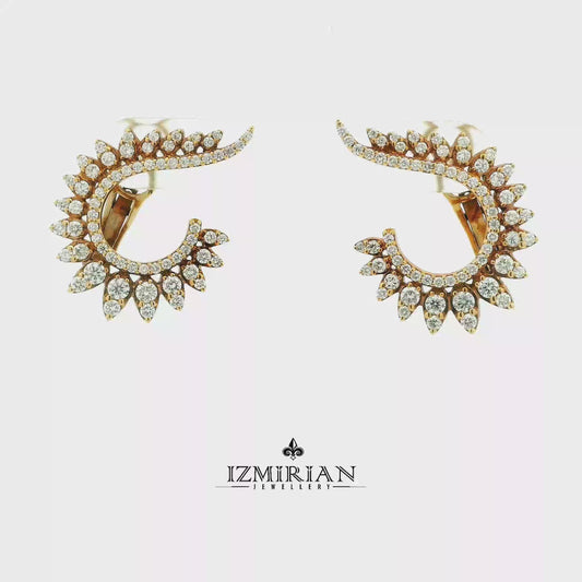 Diamond feather hoop earrings in yellow gold shown in motion
