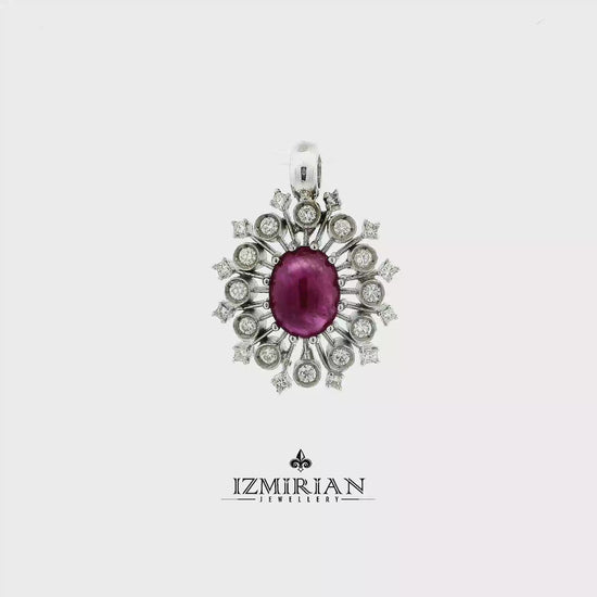 Ruby sunburst diamond pendant in white gold shown in motion