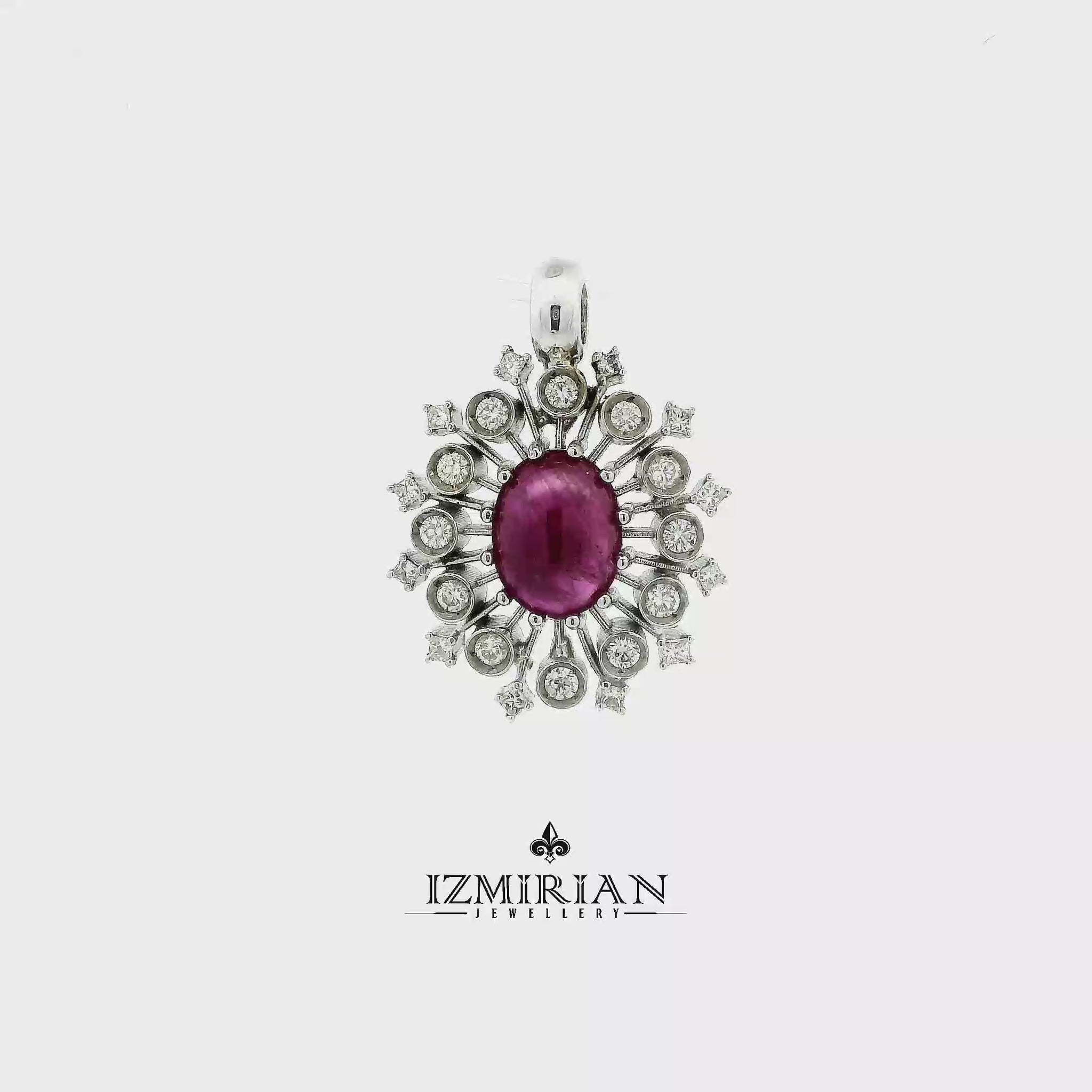 Ruby sunburst diamond pendant in white gold shown in motion