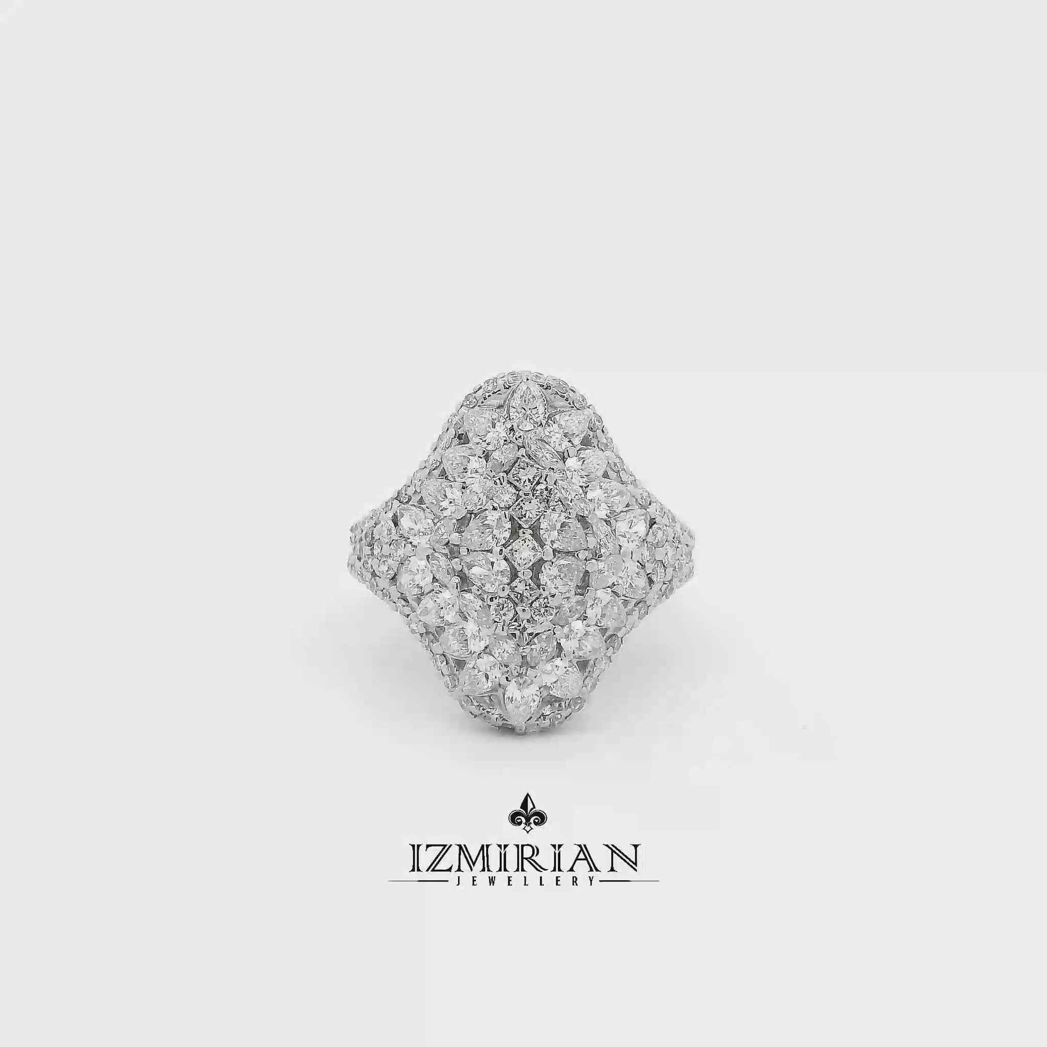 Marquise diamond cluster ring in white gold shown in motion