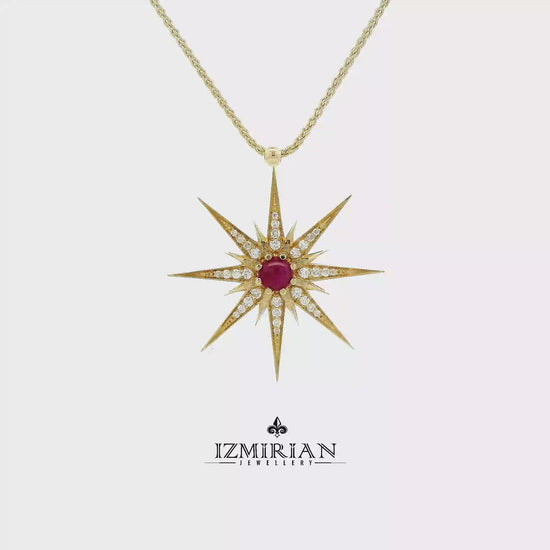 Ruby starburst diamond pendant in yellow gold shown in motion