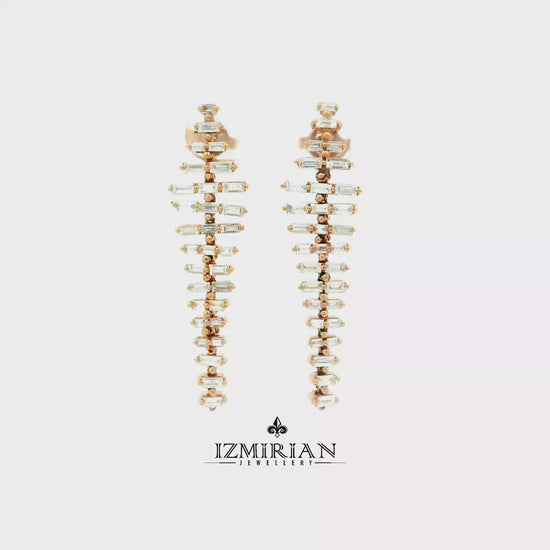 Baguette diamond drop earrings in rose gold shown in motion