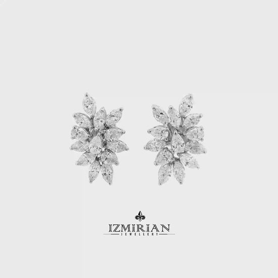 Marquise diamond cluster stud earrings in white gold shown in motion