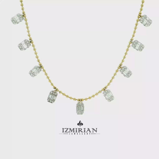 Baguette diamond charm necklace in yellow gold shown in motion