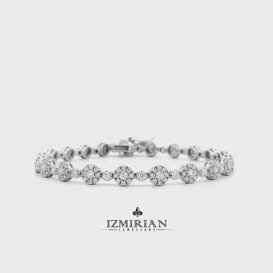 Diamond floral link bracelet in white gold shown in motion