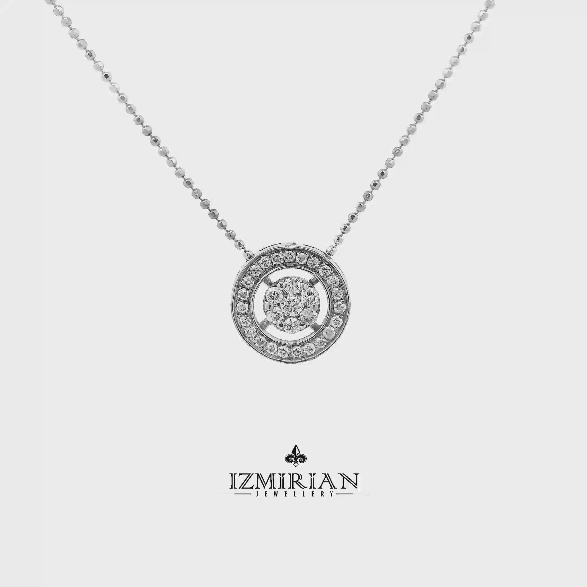 Floating diamond circle pendant in white gold shown in motion