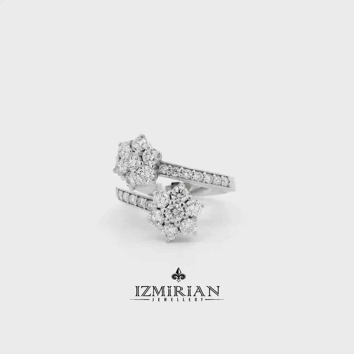 Double diamond flower open ring in white gold shown in motion