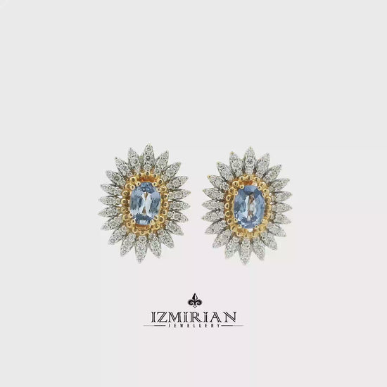 Two-tone sapphire and diamond sunburst earrings shown in motion