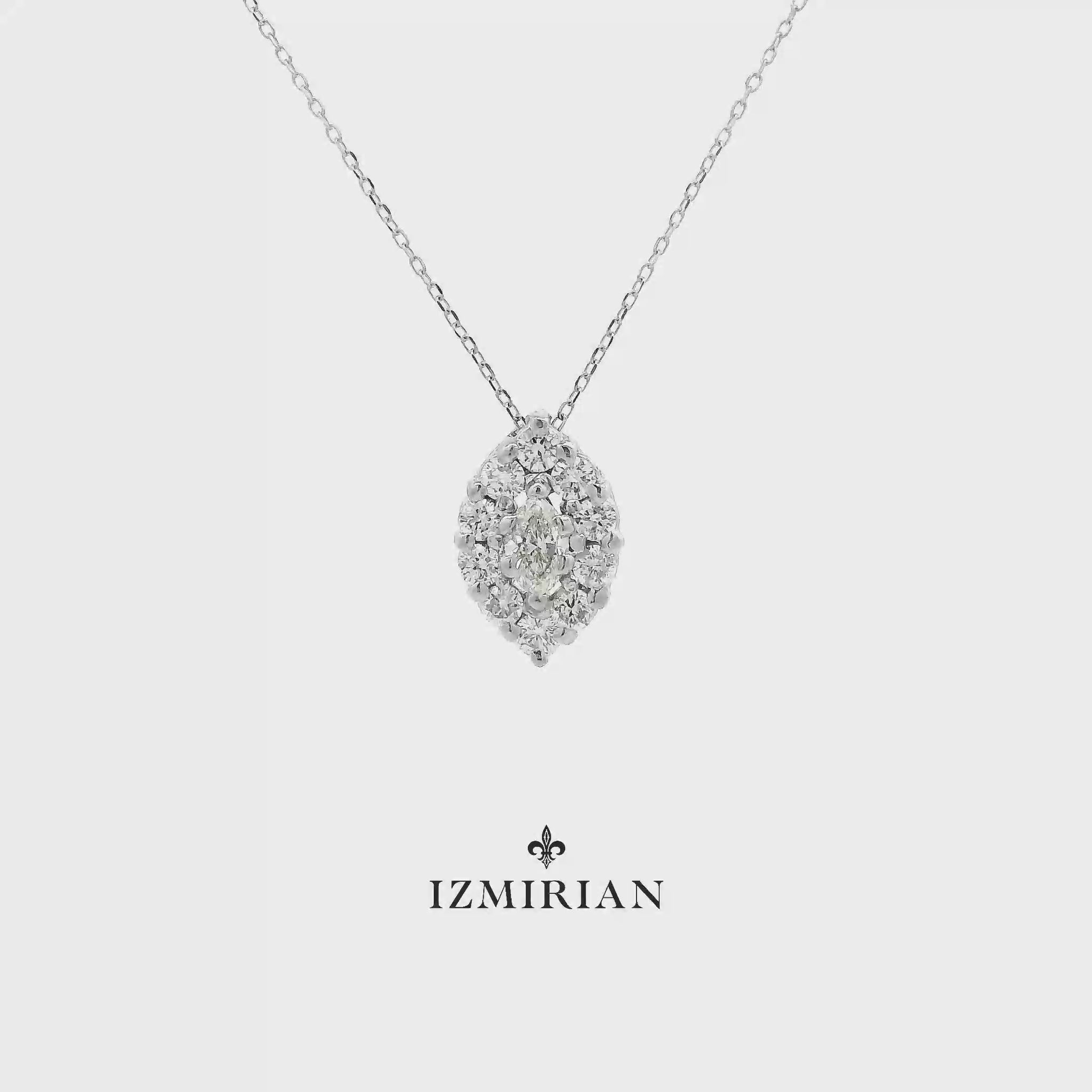 Marquise diamond cluster pendant in white gold shown in motion