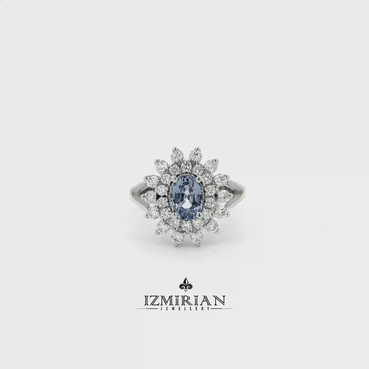 Blue sapphire floral halo ring in white gold shown from multiple angles