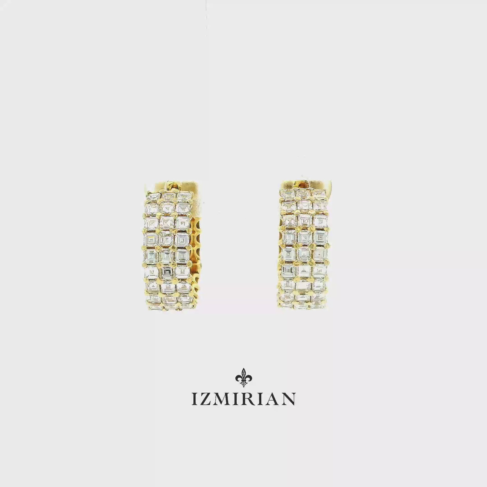 Yellow gold diamond huggie hoop earrings shown in motion