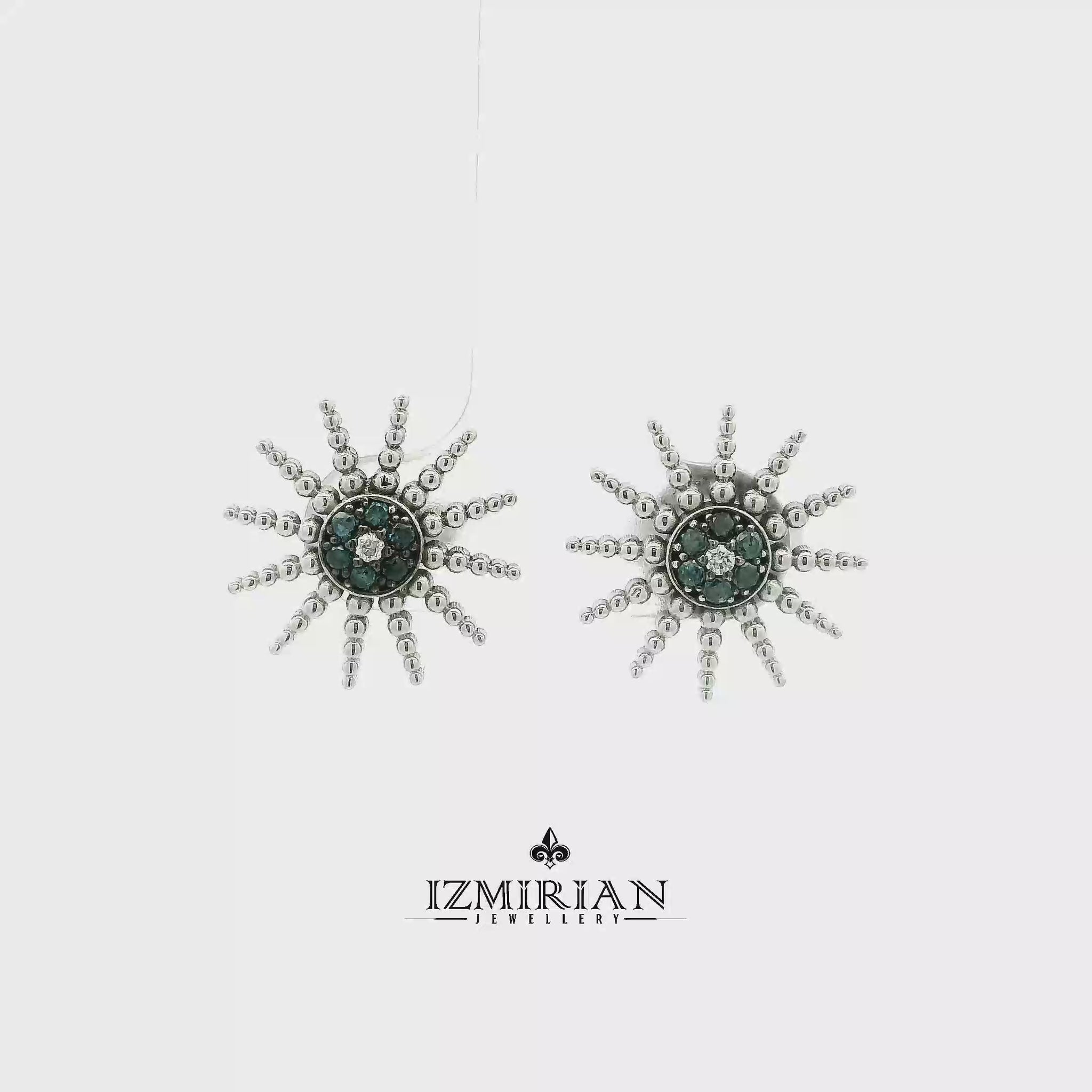 White gold sunburst stud with blue and white diamonds shown in motion