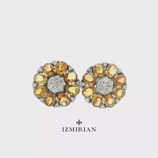 Citrine and diamond floral stud earrings in white gold shown in motion