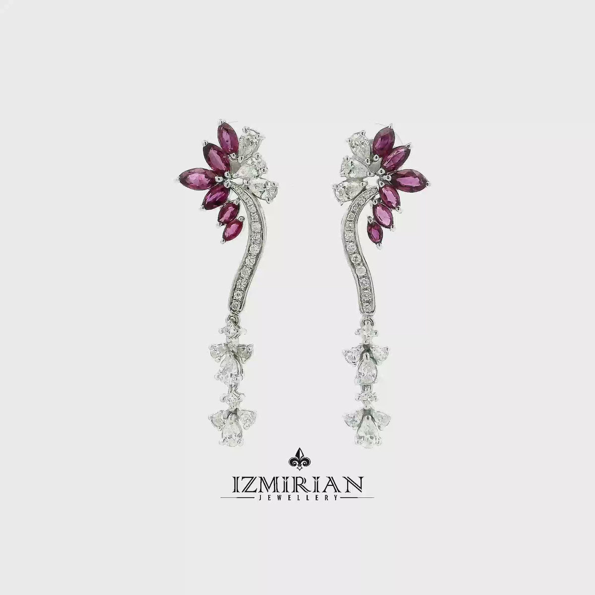 Ruby and diamond vine drop earrings in white gold shown in motion