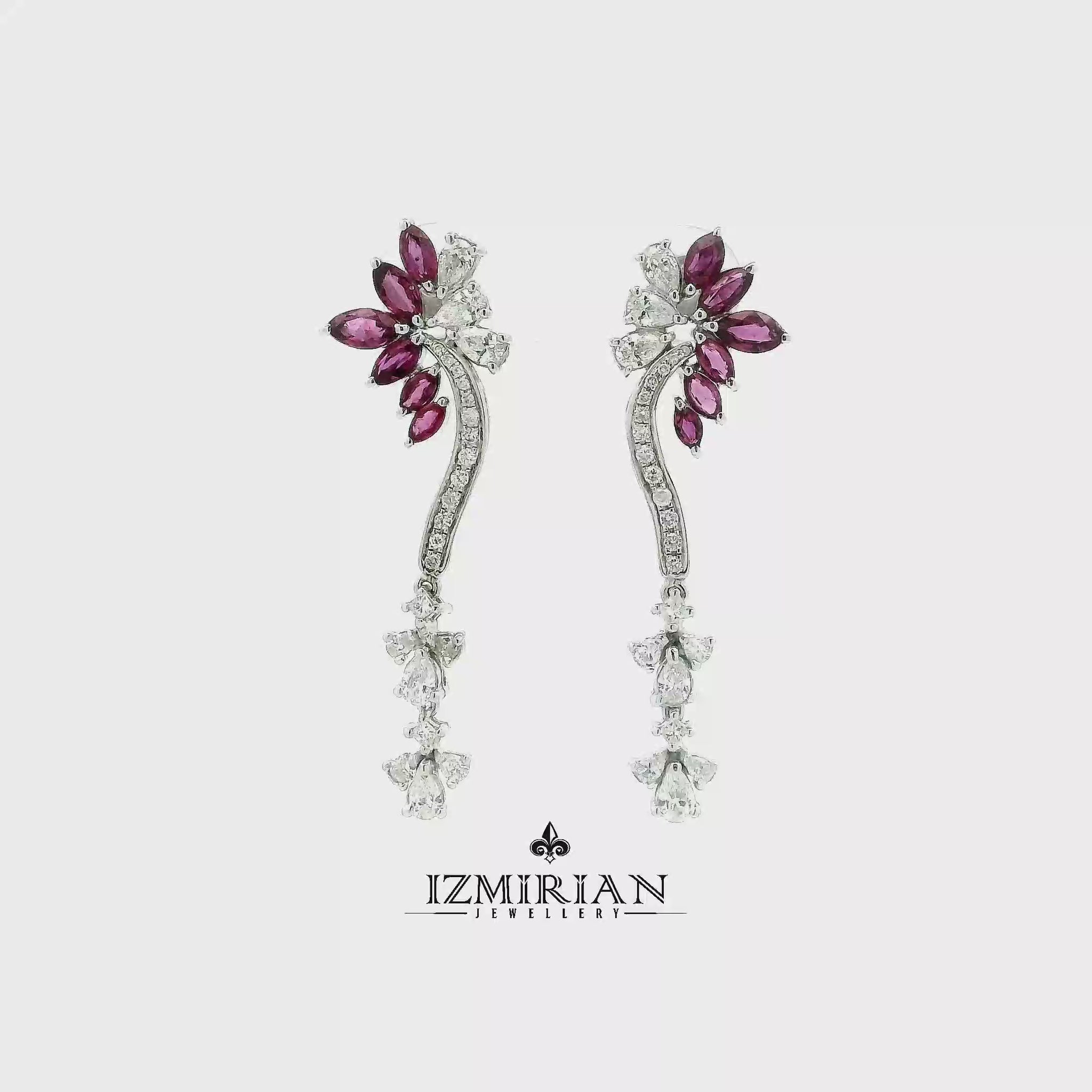 Ruby and diamond vine drop earrings in white gold shown in motion