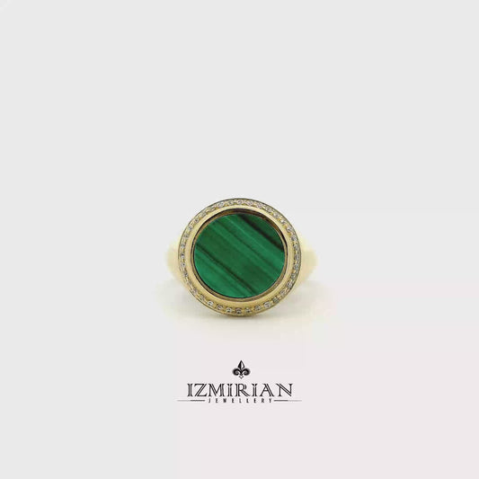 Malachite and diamond signet ring in yellow gold shown in motion
