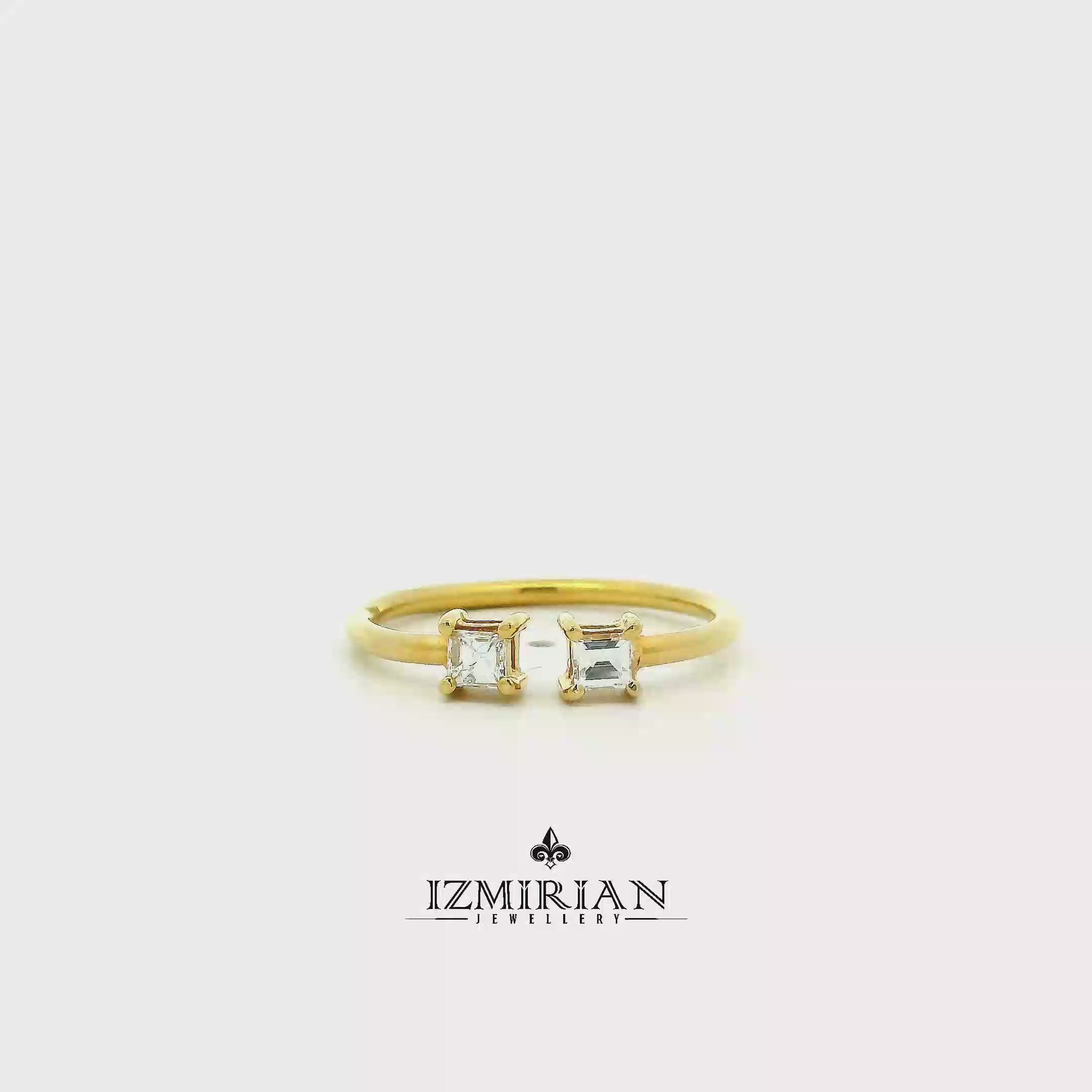 Princess cut diamond Toi et Moi ring in yellow gold shown in motion