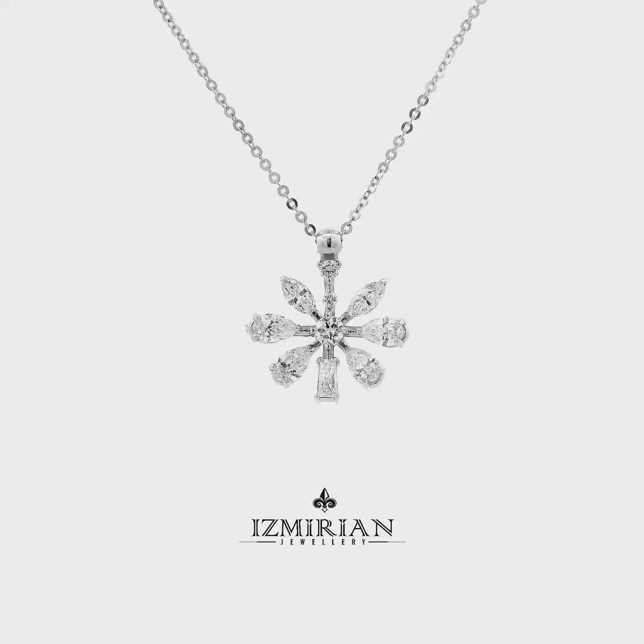 Mixed cut diamond snowflake pendant in white gold shown in motion
