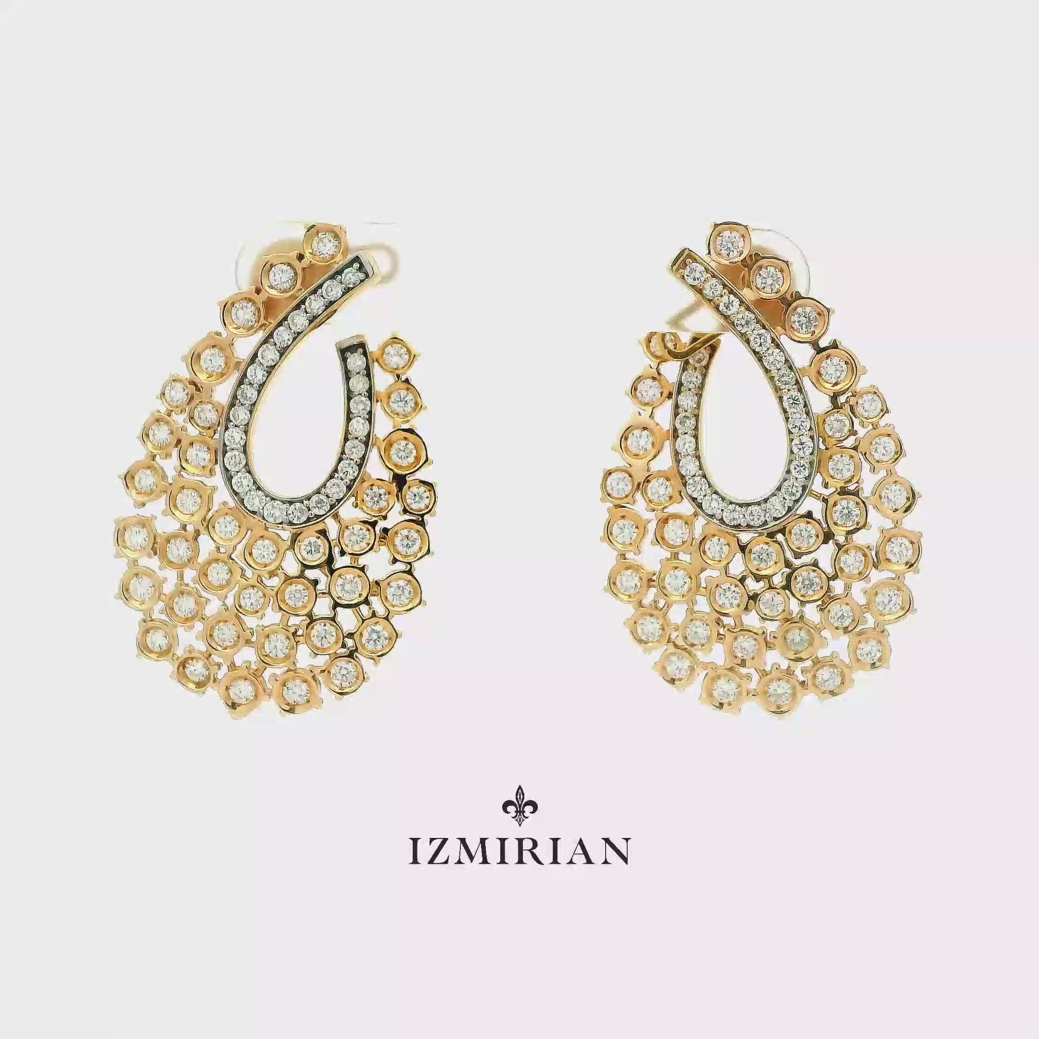 Yellow gold diamond teardrop earrings shown in motion
