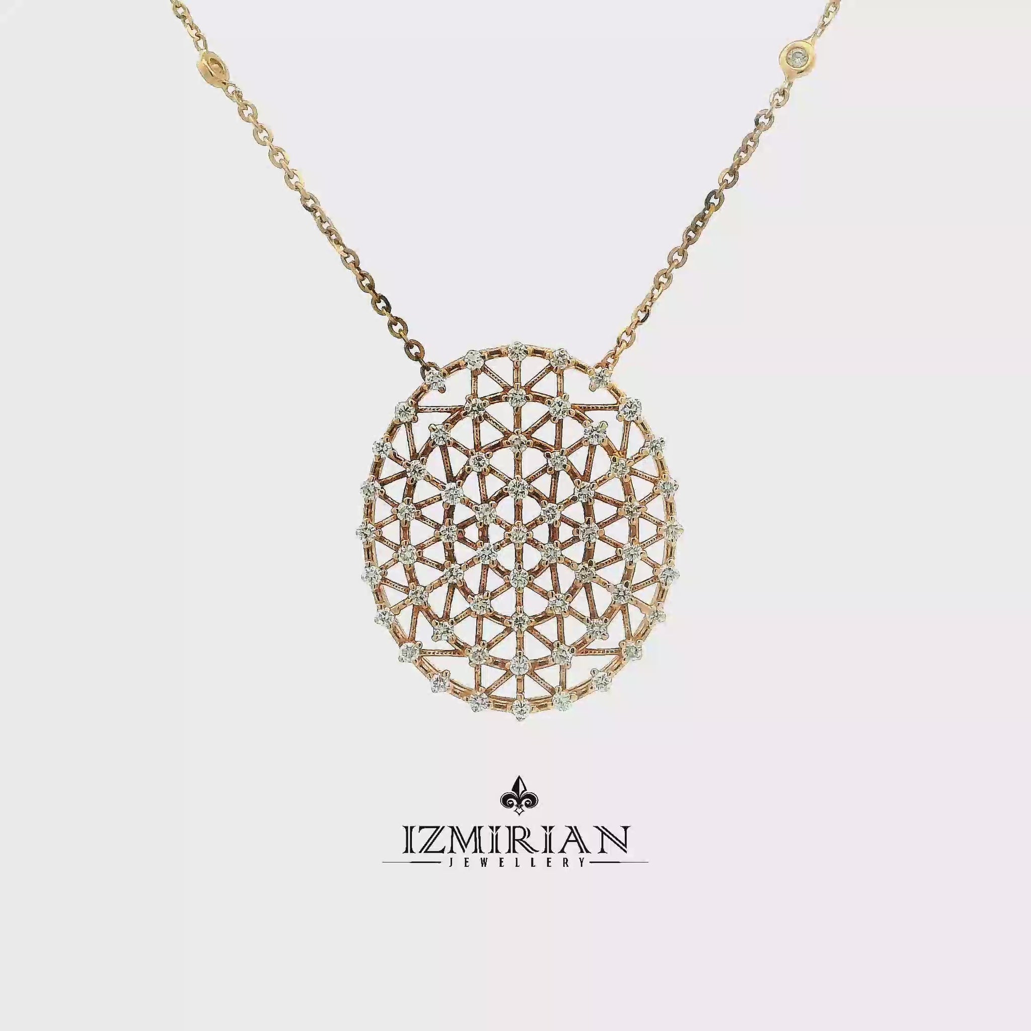 Diamond lattice disc pendant in yellow gold shown in motion