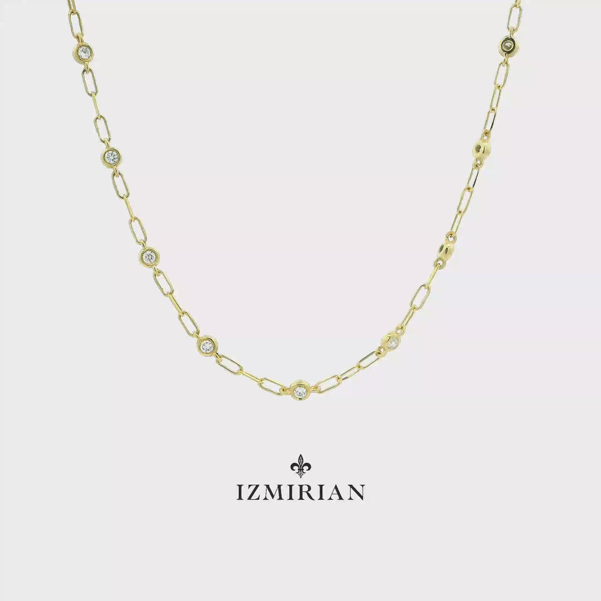 Yellow gold diamond station necklace shown in motion