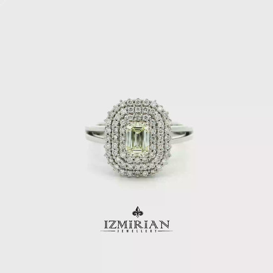 Emerald cut diamond triple halo ring in white gold shown in motion