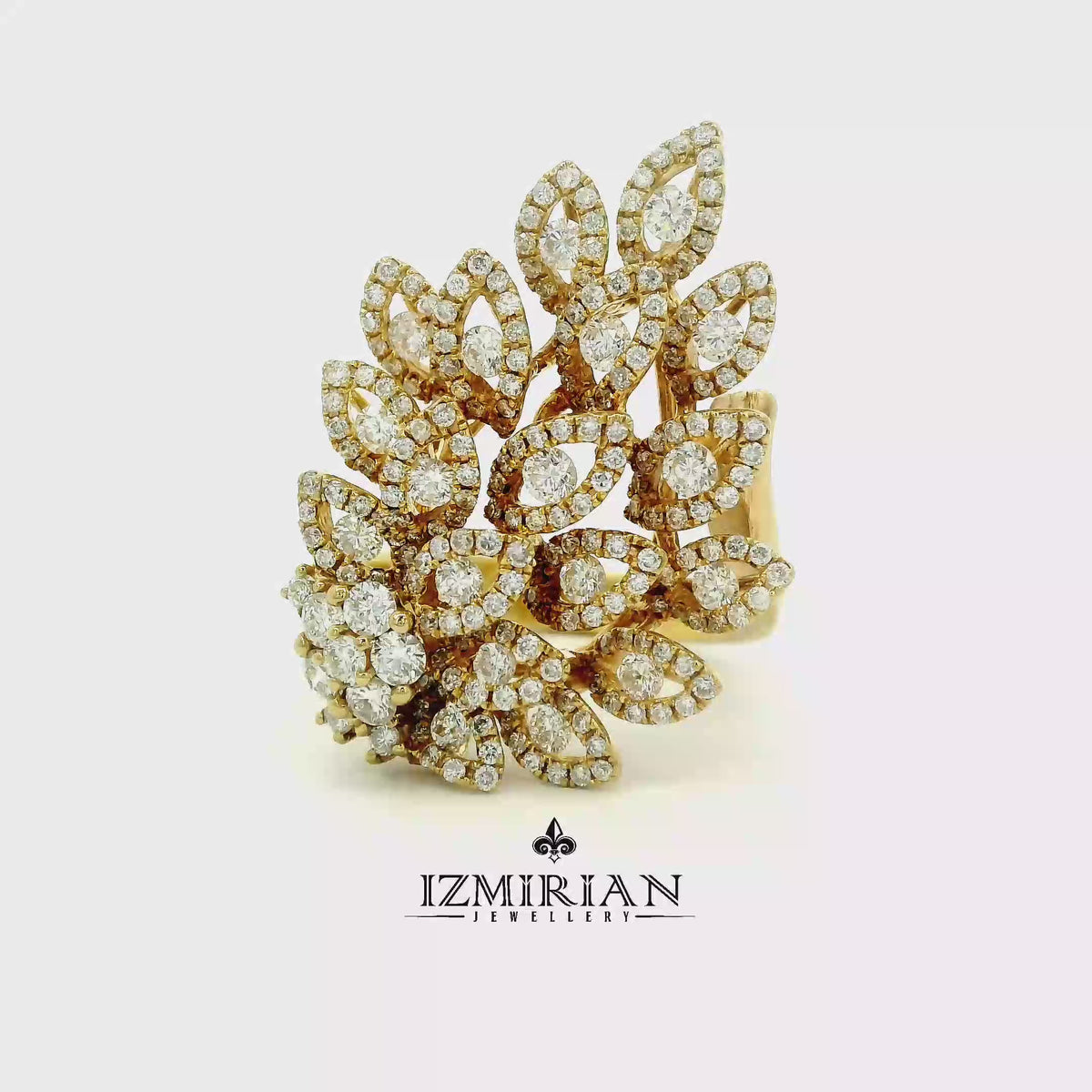 Diamond leaf cluster ring in yellow gold shown in motion