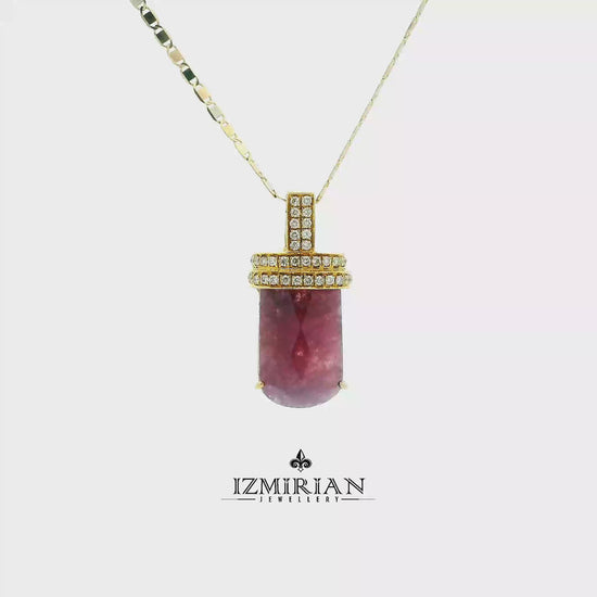 Pink tourmaline barrel pendant in yellow gold with diamond accents in motion