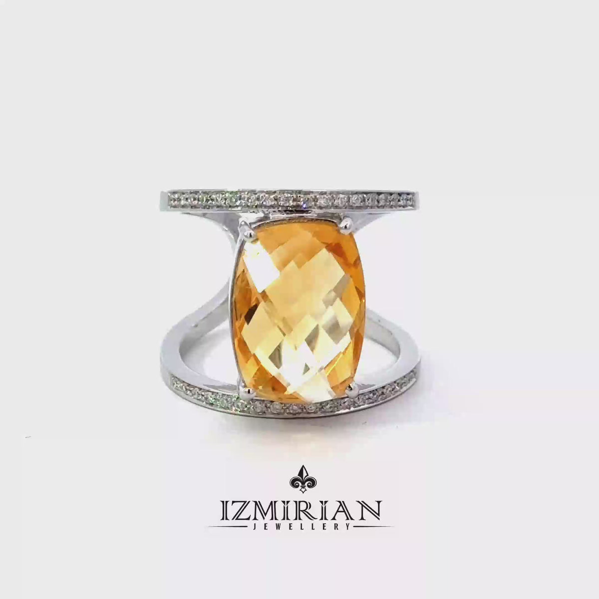 White gold open cuff ring with oval citrine shown in motion