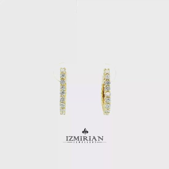 Inside out diamond hoop earrings in yellow gold shown in motion