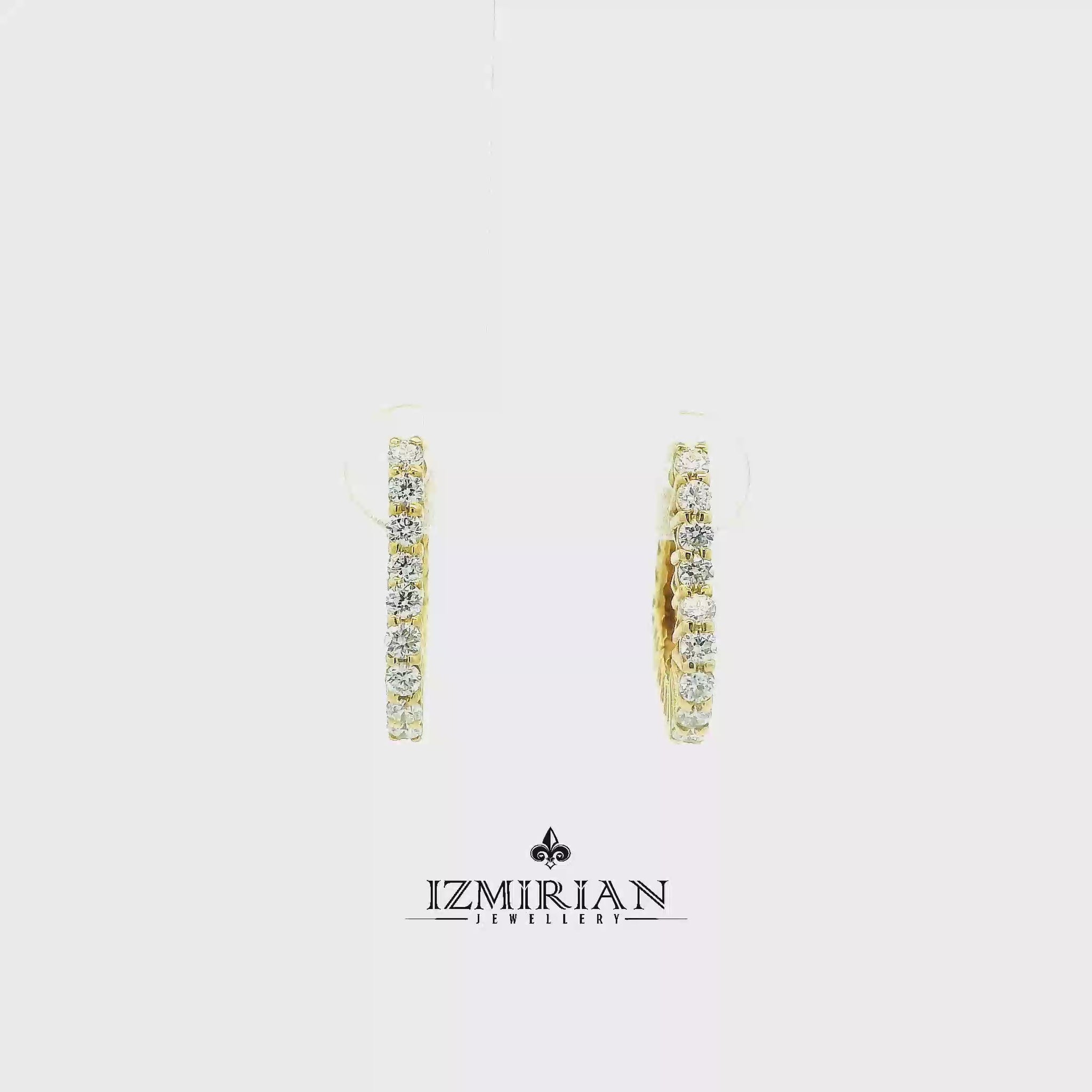 Inside out diamond hoop earrings in yellow gold shown in motion