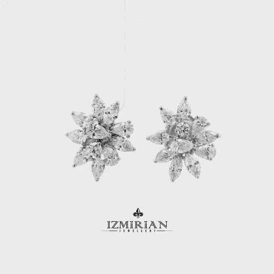 Marquise diamond flower stud earrings in white gold shown in motion
