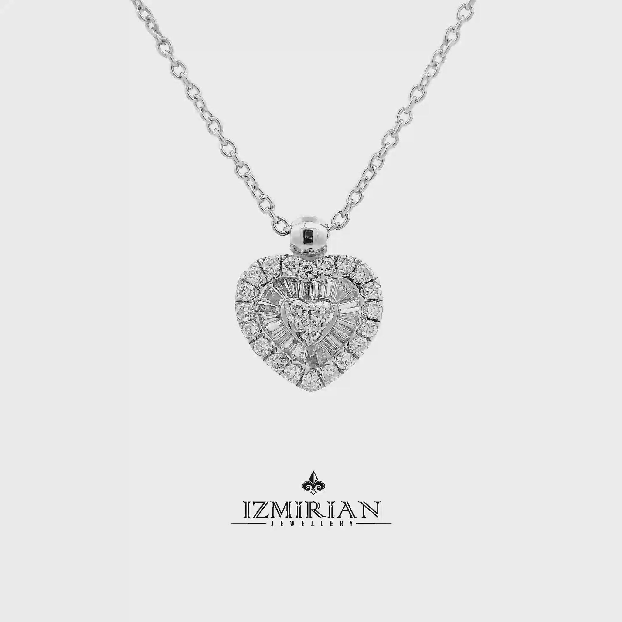 Heart diamond cluster pendant in white gold shown in motion