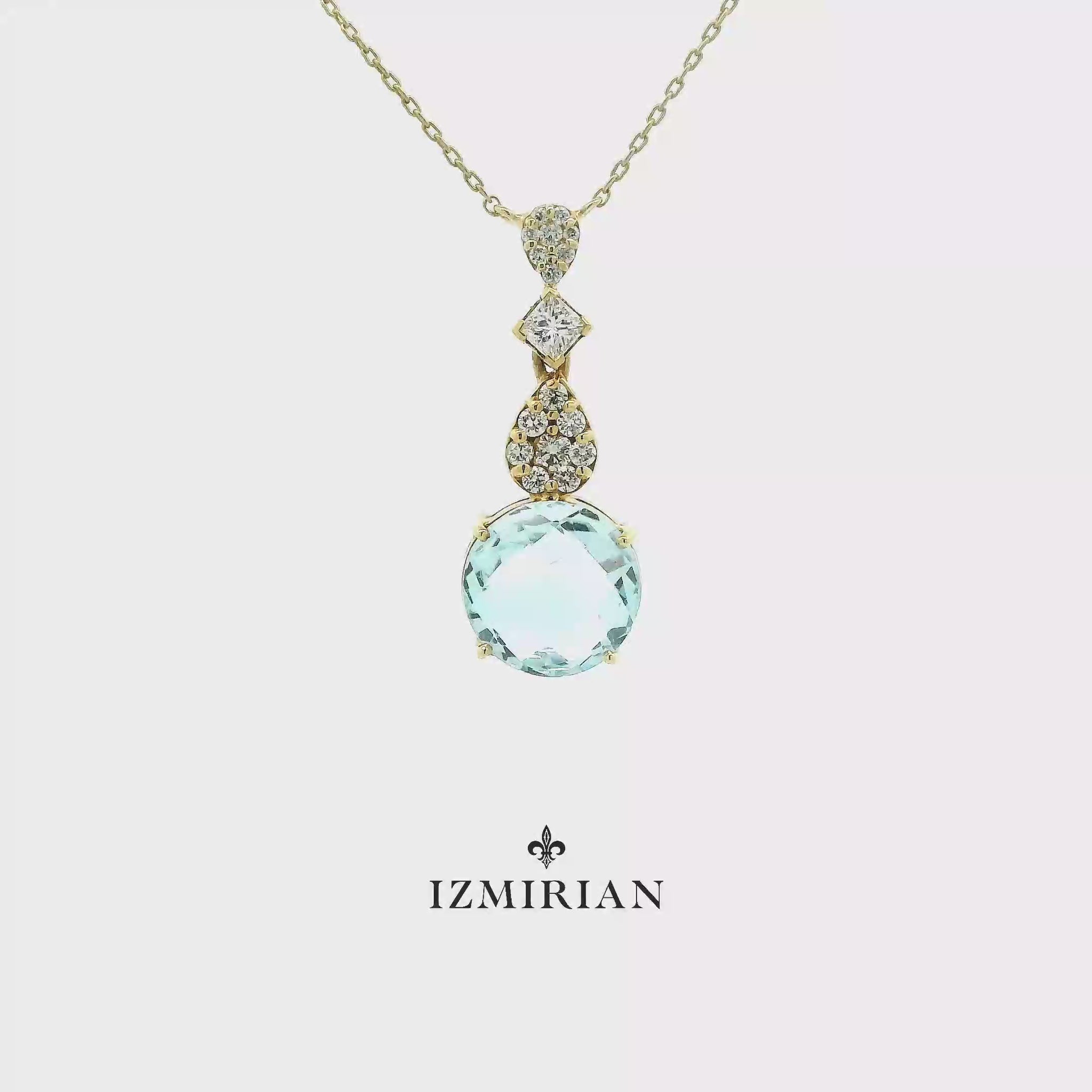 Aquamarine and diamond drop pendant necklace in yellow gold shown in motion