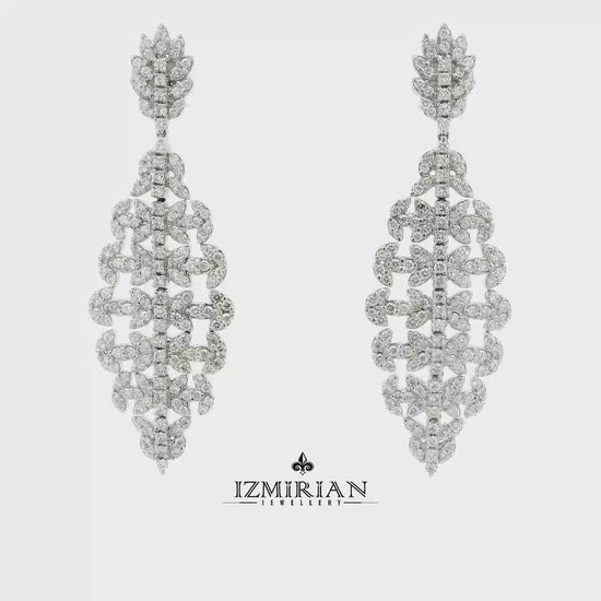 Diamond cascade drop earrings in white gold shown in motion