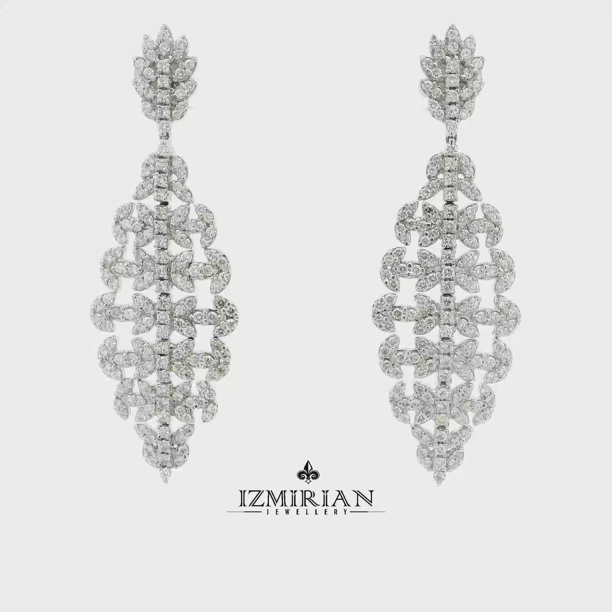 Diamond cascade drop earrings in white gold shown in motion