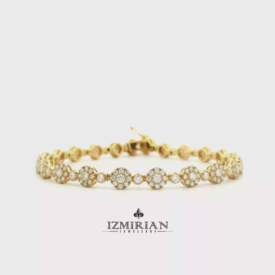 Diamond floral link bracelet in yellow gold shown in motion