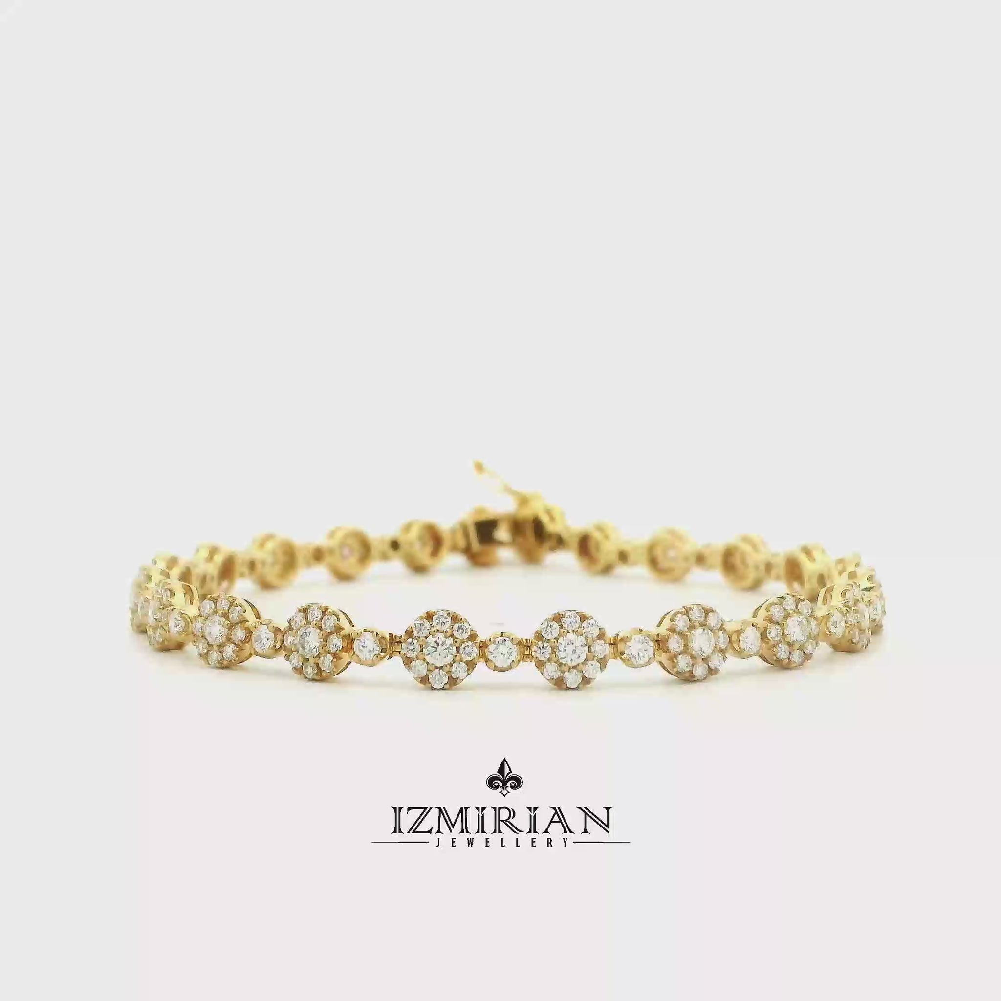Diamond floral link bracelet in yellow gold shown in motion